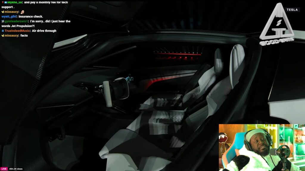 The rapper checking out the Tesla Roadster's interiors (Image via Twitch/TPAIN)